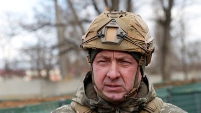 FILE PHOTO: Commander of the Joint Forces Oleksandr Pavliuk visits combat positions of the Ukrainian armed forces near the line of separation from Russian-backed rebels, near the village of Bohdanivka in the Donetsk region, Ukraine February 19, 2022. REUTERS/Valentyn Ogirenko/File Photo (REUTERS)