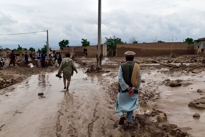 People are seen near to their damaged homes after heavy flooding in Baghlan province in northern Afghanistan Saturday, May 11, 2024. (AP) People are seen near to their damaged homes after heavy flooding in Baghlan province in northern Afghanistan Saturday, May 11, 2024. (AP)
