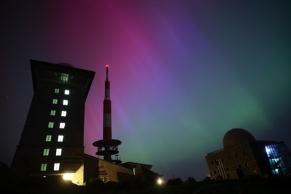 Northern lights appear in the night sky above the Brocken early Saturday, May 11, 2024, in Schierke, northern Germany. (Matthias Bein/dpa via AP) (AP) Northern lights appear in the night sky above the Brocken early Saturday, May 11, 2024, in Schierke, northern Germany. (Matthias Bein/dpa via AP) (AP)