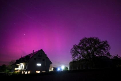 Northern lights glow in the night sky above the village of Daillens, Switzerland, early Saturday, May 11, 2024. (Laurent Gillieron/Keystone via AP) (AP) Northern lights glow in the night sky above the village of Daillens, Switzerland, early Saturday, May 11, 2024. (Laurent Gillieron/Keystone via AP) (AP)