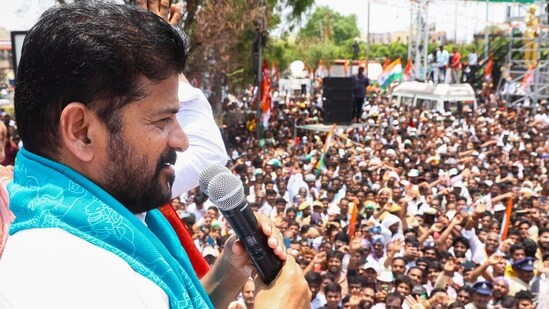 Telangana CM A Revanth Reddy addresses his supporters during a roadshow in Patancheruvu, Hyderabad.(PTI)