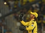 Chennai Super Kings' MS Dhoni throws the ball as he fields during the Indian Premier League (IPL) Twenty20 cricket match between Gujarat Titans and Chennai Super Kings Chennai Super Kings' MS Dhoni throws the ball as he fields during the Indian Premier League (IPL) Twenty20 cricket match between Gujarat Titans and Chennai Super Kings