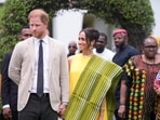 Prince Harry, left, and Meghan, right, holding hands upon arrival at the government house in Lagos Nigeria, Sunday, May 12, 2024. Prince Harry and his wife Meghan are in Nigeria to champion the Invictus Games, which Prince Harry founded to aid the rehabilitation of wounded and sick servicemembers and veterans. (AP Photo/Sunday Alamba)