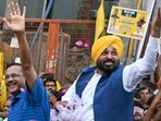 Punjab chief minister Bhagwant Mann along with Delhi CM Arvind Kejriwal during an election rally in New Delhi on Saturday. (AFP)