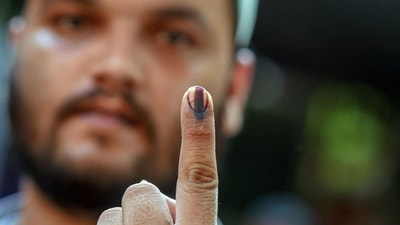 A voter's finger is marked with indelible ink after casting a ballot at a polling station during the third phase of voting for national elections in Ahmedabad, Gujarat, India, on Tuesday, May 7, 2024. Voting kicks off in Prime Minister Narendra Modi�s home state of Gujarat in the third phase of India�s election Tuesday, with campaigning becoming increasingly acrimonious between the two main parties. (Dhiraj Singh/Bloomberg) A voter's finger is marked with indelible ink after casting a ballot at a polling station during the third phase of voting for national elections in Ahmedabad, Gujarat, India, on Tuesday, May 7, 2024. Voting kicks off in Prime Minister Narendra Modi�s home state of Gujarat in the third phase of India�s election Tuesday, with campaigning becoming increasingly acrimonious between the two main parties. (Dhiraj Singh/Bloomberg)