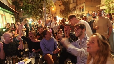 Fans tuned in to watch the final of the 68th Eurovision Song Contest (ESC) 2024 at a bar in Tel Aviv on May 12, 2024. (AFP) Fans tuned in to watch the final of the 68th Eurovision Song Contest (ESC) 2024 at a bar in Tel Aviv on May 12, 2024. (AFP)