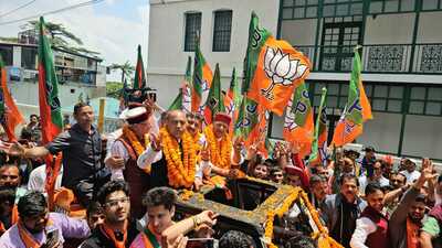 Leader of Opposition Jai Ram Thakur, BJP state chief Rajeev Bindal and BJP candidate from Shimla LS constituency Suresh Kashyap during the road show at Chaura Medan, Shimla on Sunday . (Deepak Sansta / H)