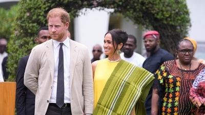 Prince Harry, left, and Meghan, right, holding hands upon arrival at the government house in Lagos Nigeria, Sunday, May 12, 2024. Prince Harry and his wife Meghan are in Nigeria to champion the Invictus Games, which Prince Harry founded to aid the rehabilitation of wounded and sick servicemembers and veterans. (AP Photo/Sunday Alamba) (AP) Prince Harry, left, and Meghan, right, holding hands upon arrival at the government house in Lagos Nigeria, Sunday, May 12, 2024. Prince Harry and his wife Meghan are in Nigeria to champion the Invictus Games, which Prince Harry founded to aid the rehabilitation of wounded and sick servicemembers and veterans. (AP Photo/Sunday Alamba) (AP)