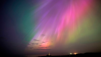 Brilliant purple, green, yellow and pink hues of the Northern Lights were reported worldwide, with sightings in Germany, Switzerland, China, England, Spain and elsewhere. (AP) Brilliant purple, green, yellow and pink hues of the Northern Lights were reported worldwide, with sightings in Germany, Switzerland, China, England, Spain and elsewhere. (AP)