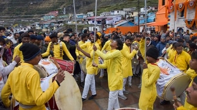 Despite the rain, scores of devotees had gathered on the temple premises, which were adorned with 15 quintals of flowers, to witness the ceremony. The doors opened at 6 am after two hours of rituals. (PTI) Despite the rain, scores of devotees had gathered on the temple premises, which were adorned with 15 quintals of flowers, to witness the ceremony. The doors opened at 6 am after two hours of rituals. (PTI)
