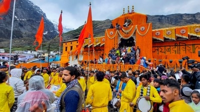Devotees arrive at the Shri Badrinath temple after its portals were opened in Chamoli district on Sunday morning. (PTI) Devotees arrive at the Shri Badrinath temple after its portals were opened in Chamoli district on Sunday morning. (PTI)