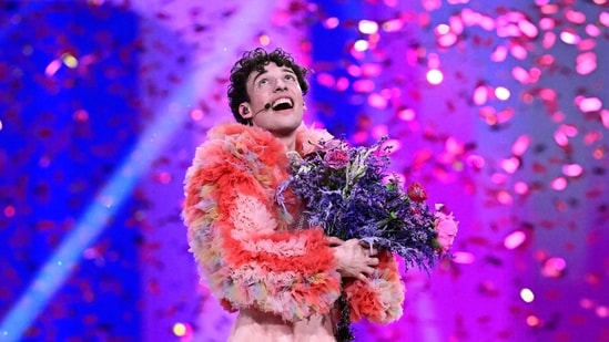 Nemo, representing Switzerland with the song The Code, celebrates on stage after winning the final in Malmo, Sweden.&nbsp;(AFP)
