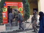 Polling officials along with security personnel arrive at a red polling station on the eve of the fourth phase of the Lok Sabha polls, in Srinagar on Sunday.(ANI)