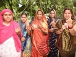 Voters showing finger ink marks after cast votes at a polling booth during 4th phase of Lok Sabha election in Ujiarpur, Bihar,