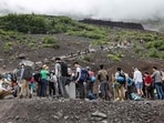 This file photo taken on August 31, 2023 shows visitors climbing the slopes of Mount Fuji, Japan's highest peak at 3,776 meters (12,388 feet). An online booking system for Mount Fuji's most popular trail was announced on May 13, 2024 by Japanese authorities trying to fight overtourism on the active volcano. This file photo taken on August 31, 2023 shows visitors climbing the slopes of Mount Fuji, Japan's highest peak at 3,776 meters (12,388 feet). An online booking system for Mount Fuji's most popular trail was announced on May 13, 2024 by Japanese authorities trying to fight overtourism on the active volcano.