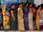 Women stand in a line to cast their votes at a polling station during the fourth phase of India's general election, in Rangareddy district in the southern state of Telangana.