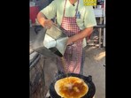 The image, taken from a viral video on X, shows a man cooking a paratha in "diesel". The image, taken from a viral video on X, shows a man cooking a paratha in "diesel".