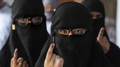 Women voters show their inked fingers at a polling station in Kanpur, Uttar Pradesh. (PTI) Women voters show their inked fingers at a polling station in Kanpur, Uttar Pradesh. (PTI)