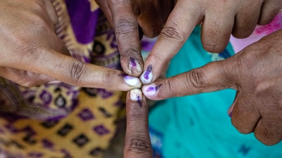 Voters show their fingers marked with indelible ink in Bardhaman, West Bengal. (PTI) Voters show their fingers marked with indelible ink in Bardhaman, West Bengal. (PTI)