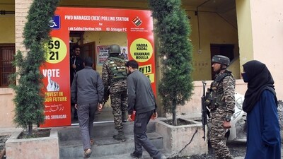 Polling officials along with security personnel arrive at a red polling station on the eve of the fourth phase of the Lok Sabha polls, in Srinagar on Sunday. (ANI) Polling officials along with security personnel arrive at a red polling station on the eve of the fourth phase of the Lok Sabha polls, in Srinagar on Sunday. (ANI)