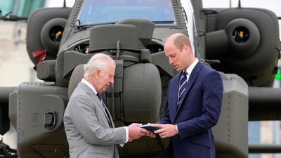 Britain's King Charles III officially hands over the role of Colonel-in-Chief of the Army Air Corps to Prince William, The Prince of Wales in front of an Apache helicopter at the Army Aviation Centre in Middle Wallop, England, Monday, May 13, 2024. (AP Photo/Kin Cheung, Pool) (AP) Britain's King Charles III officially hands over the role of Colonel-in-Chief of the Army Air Corps to Prince William, The Prince of Wales in front of an Apache helicopter at the Army Aviation Centre in Middle Wallop, England, Monday, May 13, 2024. (AP Photo/Kin Cheung, Pool) (AP)
