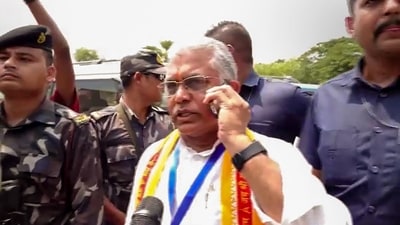 BJP candidate Dilip Ghosh talks on phone after clashes between supporters of TMC and BJP while he was on his way to a polling booth following complaints of booth jamming in Susunia area of Bardhman, (PTI) BJP candidate Dilip Ghosh talks on phone after clashes between supporters of TMC and BJP while he was on his way to a polling booth following complaints of booth jamming in Susunia area of Bardhman, (PTI)