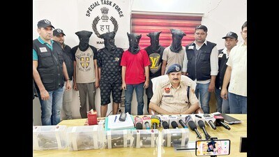 Five foreign pistols including four 9mm Glocks manufactured in Austria worth overall about ₹70-75 lakh in the international market and 51 live cartridges were seized from the possession of the arrested gang members, police said. (Parveen Kumar/HT PHOTO) Five foreign pistols including four 9mm Glocks manufactured in Austria worth overall about ₹70-75 lakh in the international market and 51 live cartridges were seized from the possession of the arrested gang members, police said. (Parveen Kumar/HT PHOTO)