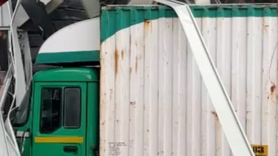 A goods transport vehicle was trapped under the collapsed billboard in Pantnagar, Ghatkopar. HT Photo A goods transport vehicle was trapped under the collapsed billboard in Pantnagar, Ghatkopar. HT Photo