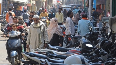 In this picture taken on March 14, 2024, people make their way through a busy market area near the Jama Masjid (mosque) at Rampur in India's Uttar Pradesh state. More than half the voters in India's city of Rampur are Muslim, but its member of parliament is a staunch supporter of Prime Minister Narendra Modi's muscular Hindu-first agenda. While India's 220 million Muslims make up 14 percent of the 1.4 billion population, Muslim representatives in parliament have almost halved to under five percent since the 1970s. (Photo by AFP) / To go with India-vote-religion-Islam-rights, FOCUS by Parvaiz BUKHARI (AFP) In this picture taken on March 14, 2024, people make their way through a busy market area near the Jama Masjid (mosque) at Rampur in India's Uttar Pradesh state. More than half the voters in India's city of Rampur are Muslim, but its member of parliament is a staunch supporter of Prime Minister Narendra Modi's muscular Hindu-first agenda. While India's 220 million Muslims make up 14 percent of the 1.4 billion population, Muslim representatives in parliament have almost halved to under five percent since the 1970s. (Photo by AFP) / To go with India-vote-religion-Islam-rights, FOCUS by Parvaiz BUKHARI (AFP)