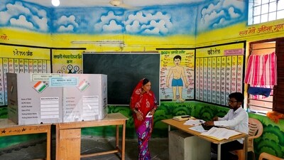 A voter walks inside a polling station during the fourth phase of the general election, in Beed, Maharashtra, (Reuters)