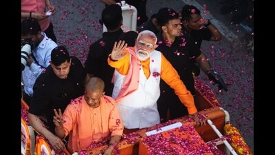 PM Narendra Modi and UP CM Yogi Adityanath during a road show in Varanasi on May 13. (Rajesh Kumar/HT) PM Narendra Modi and UP CM Yogi Adityanath during a road show in Varanasi on May 13. (Rajesh Kumar/HT)