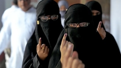 Burqa-clad voters show their inked fingers after casting their votes at a polling station during the fourth phase of Lok Sabha elections in Kanpur on May 13, 2024. (PTI) Burqa-clad voters show their inked fingers after casting their votes at a polling station during the fourth phase of Lok Sabha elections in Kanpur on May 13, 2024. (PTI)