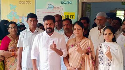Telangana chief minister Revanth Reddy along with his wife Geetha and daughter Nymisha Reddy shows their ink-marked fingers after casting their vote during the fourth phase of the Lok Sabha polls, at a polling station in Kodangal in Vikarabad on Monday. (ANI) Telangana chief minister Revanth Reddy along with his wife Geetha and daughter Nymisha Reddy shows their ink-marked fingers after casting their vote during the fourth phase of the Lok Sabha polls, at a polling station in Kodangal in Vikarabad on Monday. (ANI)