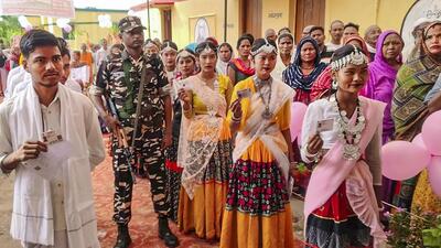 Tharu tribals dressed up in traditional attire wait to cast their vote for the fourth phase of Lok Sabha elections, at Sohni Balaigaon village located on the India-Nepal border in Bahraich on Monday. (PTI PHOTO) Tharu tribals dressed up in traditional attire wait to cast their vote for the fourth phase of Lok Sabha elections, at Sohni Balaigaon village located on the India-Nepal border in Bahraich on Monday. (PTI PHOTO)