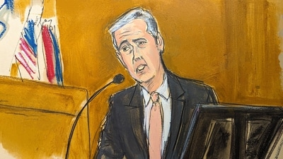 Michael Cohen testifies on the witness stand with a National Enquirer cover story about Donald Trump displayed on a screen in Manhattan criminal court, Monday, May 13, 2024, in New York. (Elizabeth Williams via AP) (AP) Michael Cohen testifies on the witness stand with a National Enquirer cover story about Donald Trump displayed on a screen in Manhattan criminal court, Monday, May 13, 2024, in New York. (Elizabeth Williams via AP) (AP)
