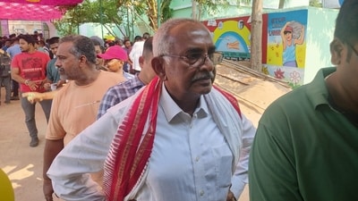 Former Odisha chief secretary and Congress candidate from Paralakhemundi assembly constituency, Bijay Patnaik, waits in line to cast his vote. 