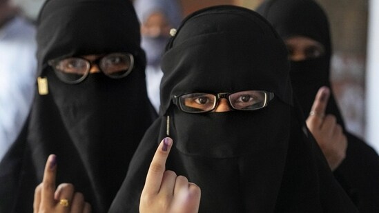 Women voters show their inked fingers at a polling station in Kanpur, Uttar Pradesh.&nbsp;(PTI)
