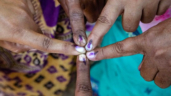 Voters show their fingers marked with indelible ink in Bardhaman, West Bengal.(PTI)