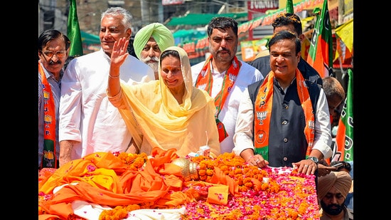 Assam CM Himanta Biswa Sarma with BJP candidate from Patiala constituency Preneet Kaur and Punjab party chief Sunil Jakhar during a roadshow in Patiala on Monday. (PTI)