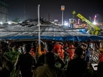 National Disaster Response Force (NDRF) personnel look for survivors during a rescue operation at the site where an advertisement hoarding collapsed on a fuel station after a dust storm in Mumbai on May 13, 2024. (Photo by Punit PARANJPE / AFP) National Disaster Response Force (NDRF) personnel look for survivors during a rescue operation at the site where an advertisement hoarding collapsed on a fuel station after a dust storm in Mumbai on May 13, 2024. (Photo by Punit PARANJPE / AFP)