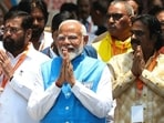 Prime Minister Narendra Modi gestures to supporters after filing his nomination papers to recontest the parliamentary seat in Varanasi. Prime Minister Narendra Modi gestures to supporters after filing his nomination papers to recontest the parliamentary seat in Varanasi.