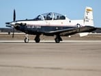 This image provided by the U.S. Air Force shows a U.S. Air Force T-6A Texan II taxiing down the flight line at Laughlin Air Force Base, Texas. The Air Force says an instructor pilot was killed when the ejection seat activated while the jet was still on the ground at Sheppard Air Force Base in Wichita Falls, Texas, when the seat activated during ground operations.