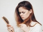 PCOS is a condition where the ovaries start to produce an abnormal amount of Androgen leading to cyst formation in the ovaries. Obesity, mood swings, menstrual irregularity, acne formation and hair loss are some of the common symptoms of PCOS. Hair loss is a pressing issue faced by people with PCOS. Dietitian Tallene Hacatoryan explained a few root causes of hair loss with PCOS.(Shutterstock)