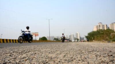 A view of a broken road near Sector 117, Noida, on Tuesday. (Sunil Ghosh/HT Photo) A view of a broken road near Sector 117, Noida, on Tuesday. (Sunil Ghosh/HT Photo)