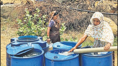 A woman in Kathoda village fills water from tankers. Villagers say tanker water cannot be used for drinking A woman in Kathoda village fills water from tankers. Villagers say tanker water cannot be used for drinking