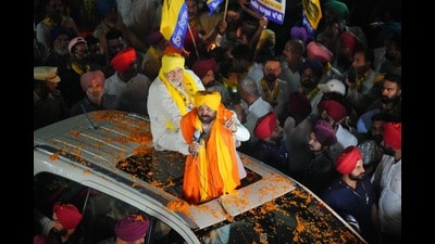 Chief minister Bhagwant Mann addressing a roadshow in Jodhan in favour of party nominee Ashok Parashar Pappi. (HT)