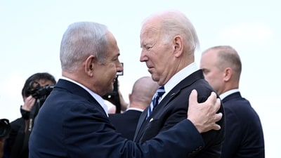 (FILES) Israel Prime Minister Benjamin Netanyahu (L) greets US President Joe Biden upon his arrival at Tel Aviv's Ben Gurion airport on October 18, 2023, amid the ongoing battles between Israel and the Palestinian group Hamas. Biden spoke by phone with Netanyahu April 4, 2024, the White House said, amid growing outrage over an Israeli strike that killed seven aid workers in Gaza. (Photo by Brendan SMIALOWSKI / AFP) (AFP) (FILES) Israel Prime Minister Benjamin Netanyahu (L) greets US President Joe Biden upon his arrival at Tel Aviv's Ben Gurion airport on October 18, 2023, amid the ongoing battles between Israel and the Palestinian group Hamas. Biden spoke by phone with Netanyahu April 4, 2024, the White House said, amid growing outrage over an Israeli strike that killed seven aid workers in Gaza. (Photo by Brendan SMIALOWSKI / AFP) (AFP)