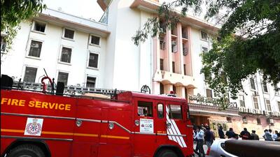 Firefighters at the Income Tax Office in ITO in New Delhi on Tuesday. (Arvind Yadav/HT Photo) Firefighters at the Income Tax Office in ITO in New Delhi on Tuesday. (Arvind Yadav/HT Photo)
