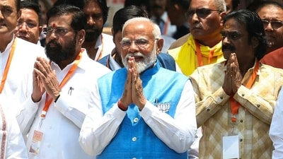 Prime Minister Narendra Modi gestures to supporters after filing his nomination papers to recontest the parliamentary seat in Varanasi. (AFP) Prime Minister Narendra Modi gestures to supporters after filing his nomination papers to recontest the parliamentary seat in Varanasi. (AFP)