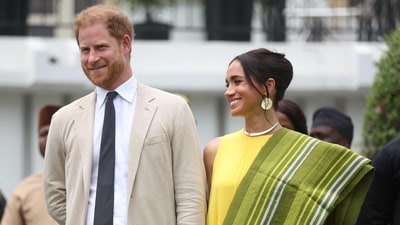 Britain's Prince Harry (2ndR), Duke of Sussex, and Britain's Meghan (R), Duchess of Sussex, react as Lagos State Governor, Babajide Sanwo-Olu (unseen), gives a speech at the State Governor House in Lagos on May 12, 2024 as they visit Nigeria as part of celebrations of Invictus Games anniversary. (Photo by Kola SULAIMON / AFP) (AFP) Britain's Prince Harry (2ndR), Duke of Sussex, and Britain's Meghan (R), Duchess of Sussex, react as Lagos State Governor, Babajide Sanwo-Olu (unseen), gives a speech at the State Governor House in Lagos on May 12, 2024 as they visit Nigeria as part of celebrations of Invictus Games anniversary. (Photo by Kola SULAIMON / AFP) (AFP)